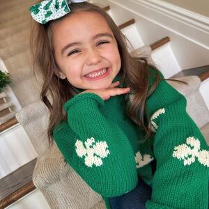 the RED WAGON Green All Over White Shamrocks Roll Neck Sweater Unisex